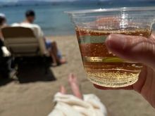 Champagne lakeside. Can confirm that the lake is cold. I have been in just far enough and long enough to pee. 