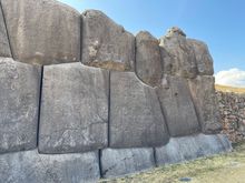 Huge stones stacked precisely together to form the wall