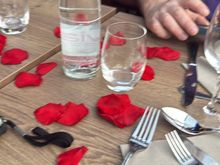 Table set up with rose petals