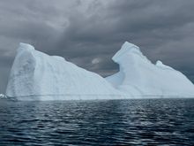 Well, the kayaking trip started out sunny… But fortunately, the gray clouds did not bring any precipitation, but did provide a nice backdrop to this iceberg.