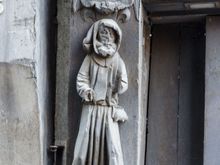 Note how they are depicted as standing atop the poor every day shmuck. A similar carving there of St. Martin shows him holding a staff (representing the church) while doing the same.