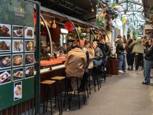 Paris' famed Marche des Rouge Enfants. We hadn't been for a while but wanted to sneak it in on our final day of the trip. Our age showed when while dining there, it suddenly struck us that we were almost old enough to be grandparents to the youthful demographic. Sweet Jayzus was it ever LOUD for a Sunday afternoon. One butcher/vendor drew a curious young (i.e. 30ish) crowd as he macheted a massive beef carcass into pieces right there on a table.