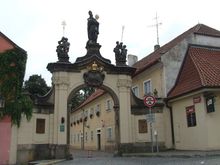 dcd ,    you enter through this gate which is the Strahov Gate.
Then you walk up to the Strahov Monastery  ( I had a Private Guide)  and you tour this very lovely place and it's  gorgeous Theological Library.

and in the Library   you will see  the very beautiful  ornate Library of the pictures dcd posted.  :S-
