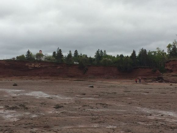 Note the lighthouse waaaaaaaay up there, and a pair of humans in the picture for scale.

