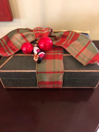 Shagreen boxes in foyer are wrapped like presents