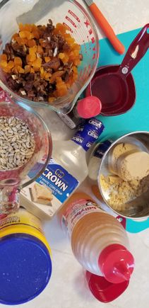 Decided to whip up some Granola Bars this afternoon.

Dates, dryed cranberries and dried apricots and sesame seeds, sunflower seeds , rolled oats, corn syrup, honey, brown sugar , butter.
