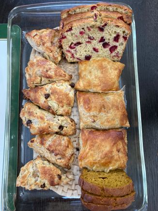 Christmas breakfast bread assortment (cranberry-banana bread, pumpkin bread, apple turnover, pear-chocolate chip scones, apple-cinnamon scones)