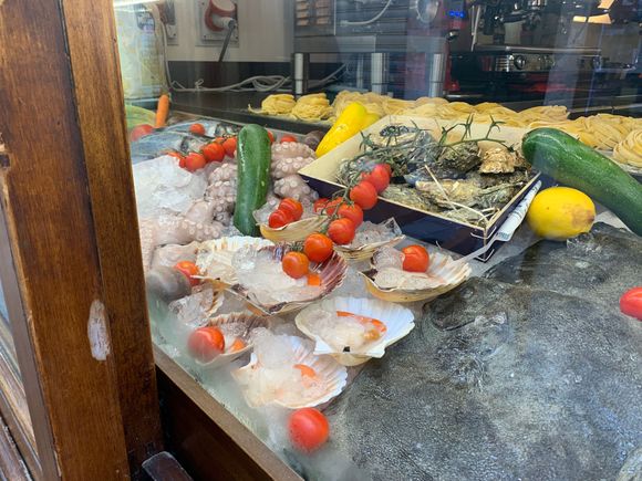 King Scallops, octopus and assorted seafood in a shop window the Cannoneggio sestiere in Venice.
