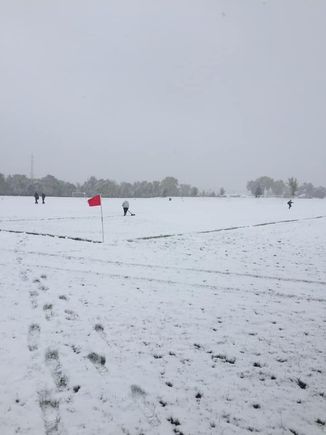Shoveling the soccer lines before just calling the game.