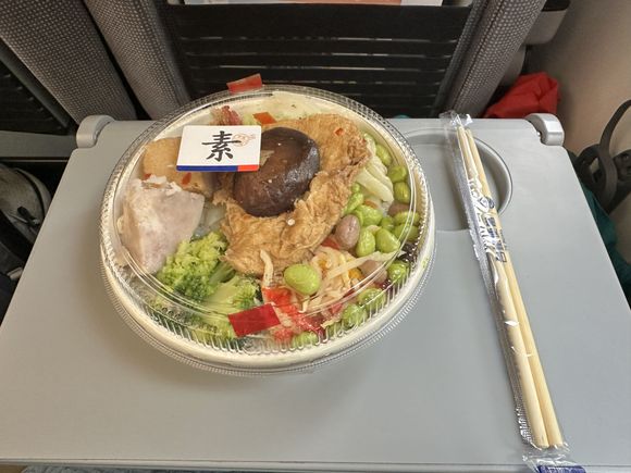 What you don't see here is the generous bed of rice underneath. Even the chopsticks have the TRA branding!