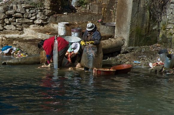 These heavily-layered women may have been working with toxic waste.