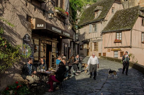 St. Jacques Cafe crowd and plump owner.