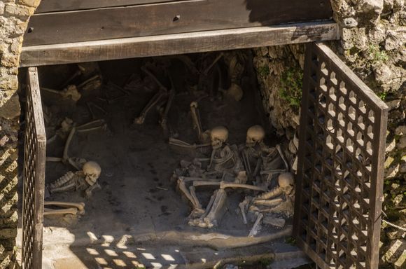 The unfortunate Vesuvius victims evident at Herculaneum. You may recall reading about them in the National Geographic cover story from decades ago (the woman still wearing her rings). These skeletons are currently prohibited from the public, as extensive renos are underway to upgrade the pathway in front.