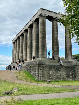 Calton Hill in Edinburgh. This is the unfinished National Monument of Scotland. Initiated in 1816, a year after Napoleon's defeat at Waterloo, the monument was meant to be a replica of the Parthenon in Athens, as a memorial to those who had died in the Napoleonic Wars.

Building began in 1822, but funds ran dry by 1829, and only a facade of the building was completed. It was dubbed "Edinburgh's shame", but it's now a popular landmark and it's a lot of fun crawling up and down its giant steps. 