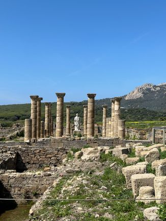 Overview of the site, presided over by statue of Emperor Trajan, which was believed to have been abandoned after an earthquake, followed by pirate incursions,  in the Third Century CE.  Baelo Claudia is said to be the best preserved Roman town on the Iberian Peninsula.