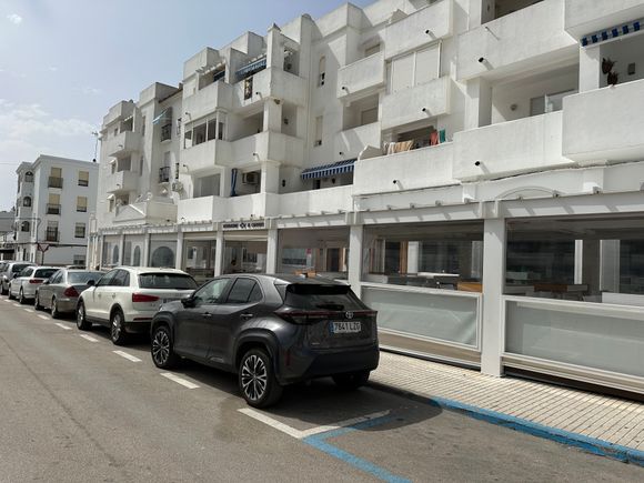 The unprepossessing exterior of the single-story EL CAMPERO; in high season, they open a covered terrace across the street from the restaurant