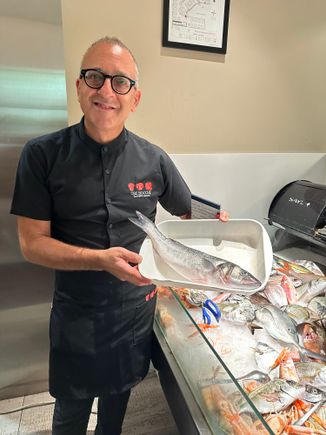 Our waiter showing us the spigot II selected, to be baked in salt..fish bar is at front and you choose your selections there; there is also a lobster tank for pasta with aragosta