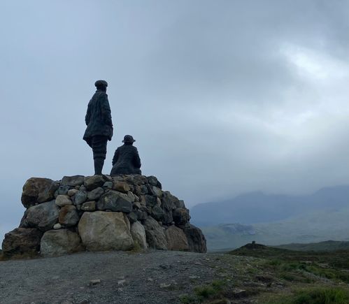 Collie and Mackenzie viewing the misty mountains that they mapped 130 years ago