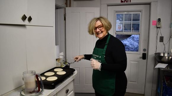 Pancakes cooked on a griddle because stove was busy with eggs and home fries 