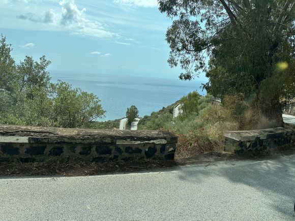 View of road switchbacks leading down to beach; there are many sharp curves on all Salina roads (only one "main" road on the island)