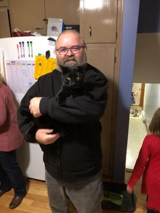 Blackie acts more like a dog than he does a cat. Last year he knocked the Christmas tree over 4 times in 3 weeks. 