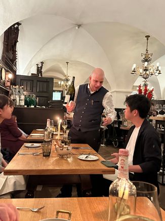 Our wonderful waiter, at adjacent table; we had a corner booth with lots of room