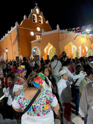 A big crowd, some seated, a lot standing