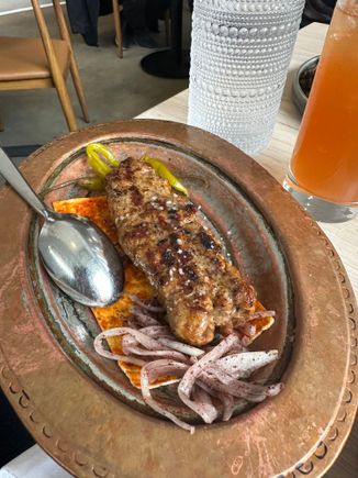 Adana Kebab, grilled tomatoes,sumac, harissa pita, pickles chiles and onions