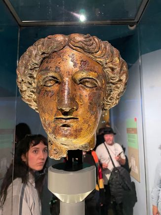 In Roman times this was a huge complex with a temple.  Inside the temple would have been a statue of Sulis Minerva.  Head of Minerva, body has been lost.