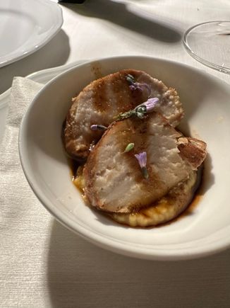 Slices of swordfish layered over a puree of chickpeas (ceci) 