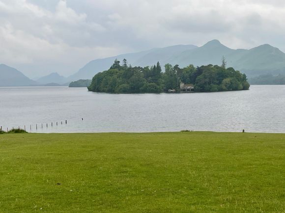 Island with a big house on it and a dock