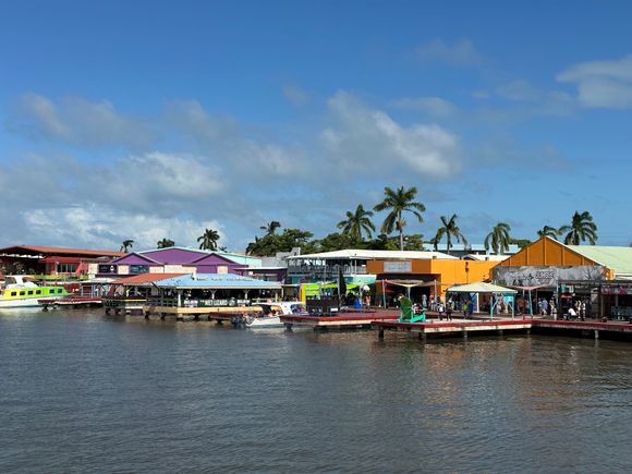 Approaching the tender docks; array of the typical shops aimed a cruisers....not as spiffy as those in other ports, but the same junky stuff for sale..skppped all that and wandered into town, which begins just after the parking lot.   Access to this area does not seem to be off limits to locals; security half hearted at best..