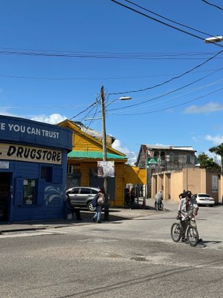 Typical scene near the docks; not many cars, many people walking or on bikes.  I stopped into a local supermarket but could not find anyone selling fresh fruit....