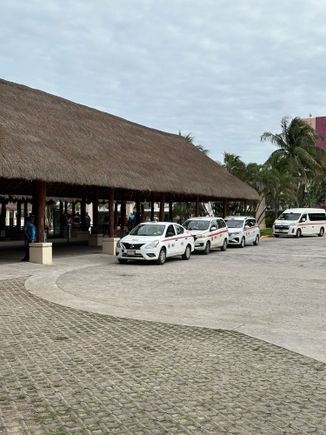 Taxis waiting at the cruise port, Puerta Maya.  The guys who rent their taxis seem to stick to the official rates, which are posted here and at the beaches...I walked away from this area and got a taxi on the street...