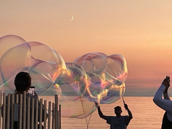 The Bubble Guy. The last two nights, there has been a guy down on the beach making these fantastic bubbles.  There are really amazing, each set different.