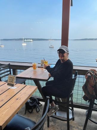 The happy girl on her birthday, shore side.