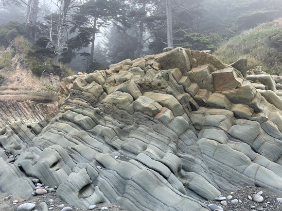 You have to climb down rocks like these to get to the beach.  We haven't seen rocks like these on a beach on our trip so far.