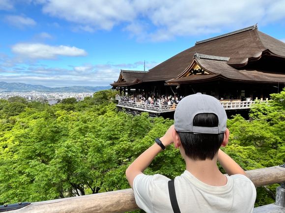 My son checking out the crowds behind us