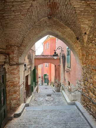 Pretty archway with pink buildings