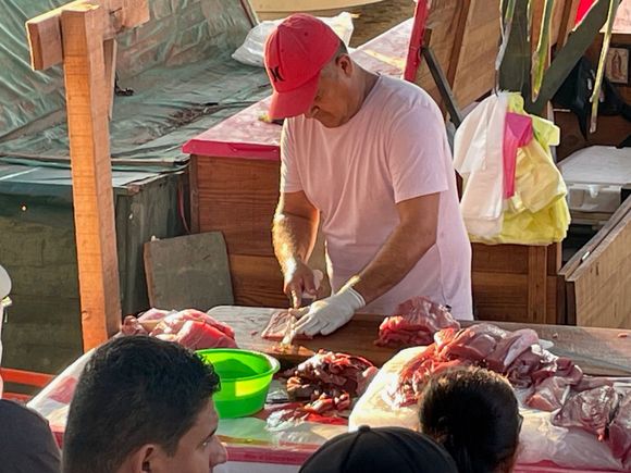 I've bought my fish, now this guy will fillet it for me in about a hot minute.