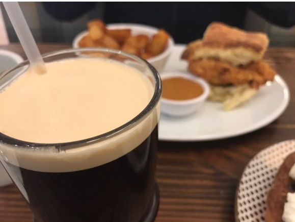 Fried chicken biscuit and nitro cold brew coffee at Miller's All Day