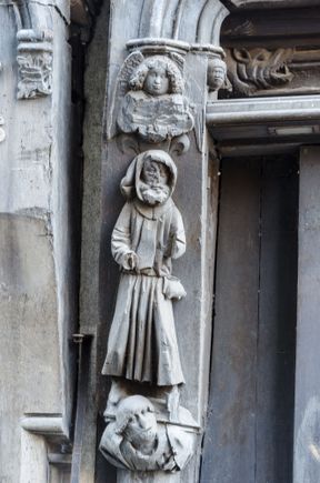 Note how they are depicted as standing atop the poor every day shmuck. A similar carving there of St. Martin shows him holding a staff (representing the church) while doing the same.