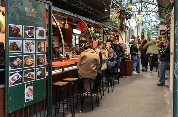 Paris' famed Marche des Rouge Enfants. We hadn't been for a while but wanted to sneak it in on our final day of the trip. Our age showed when while dining there, it suddenly struck us that we were almost old enough to be grandparents to the youthful demographic. Sweet Jayzus was it ever LOUD for a Sunday afternoon. One butcher/vendor drew a curious young (i.e. 30ish) crowd as he macheted a massive beef carcass into pieces right there on a table.