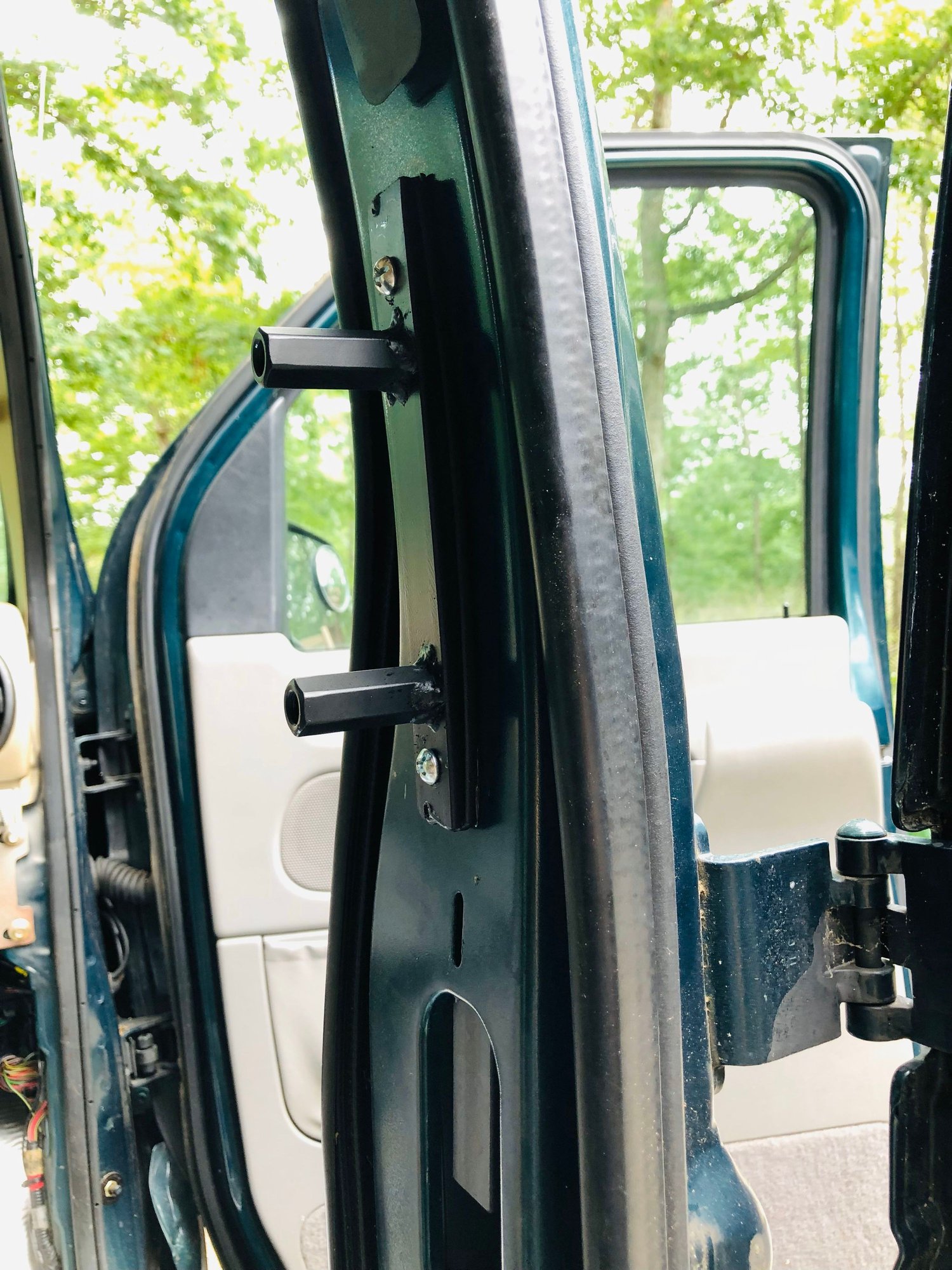 b-pillar grab handle base plate installed