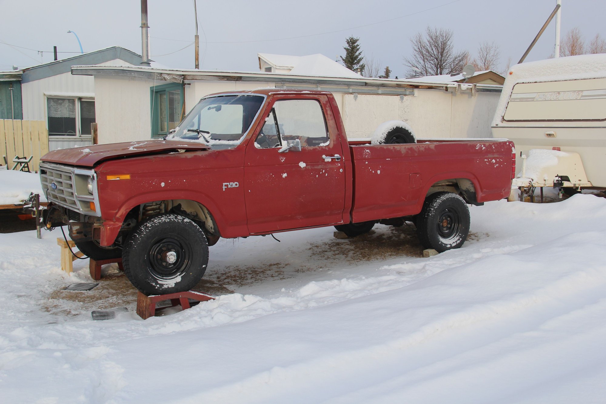  Here she  is ,  As  you  can  see  I  have  her  up  on  ramps  so  I  can  do some  cleaning  underneath a  lot  easier ..  There  is  still  lots  of  original  undercoating  underneath.. Not  to  bad  for $ 400 dollars. 