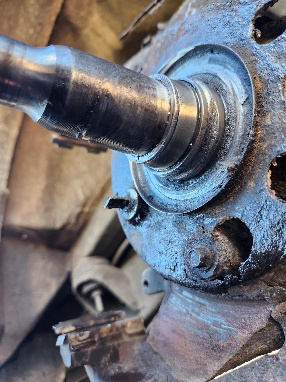 /96 E150. Front wheel inner bearing stuck on spindle w/ gouges. Easier