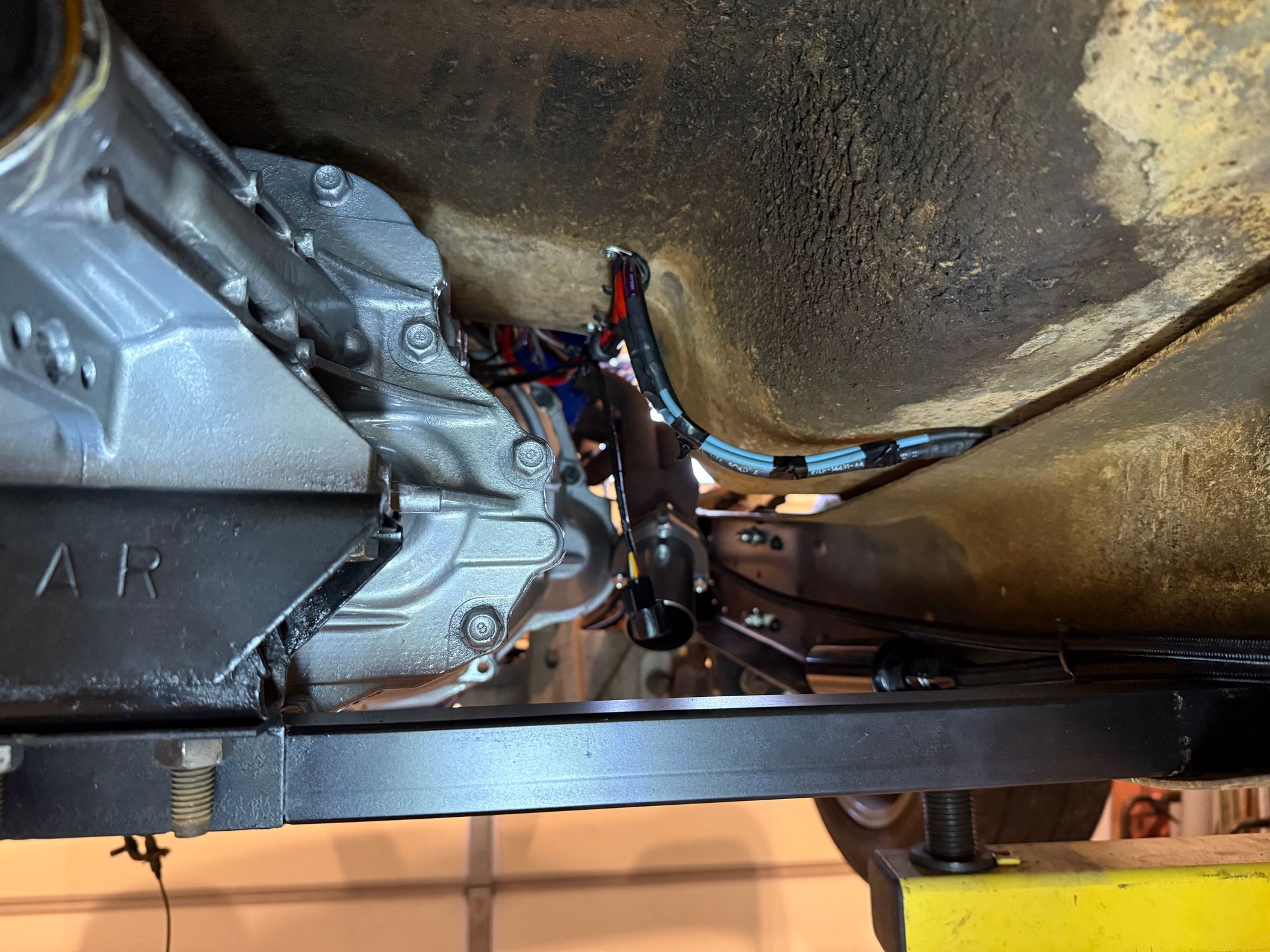 The bundle will be terminated at an insulated stud. A heavy cable will come from the battery and another will go to the starter from there. 