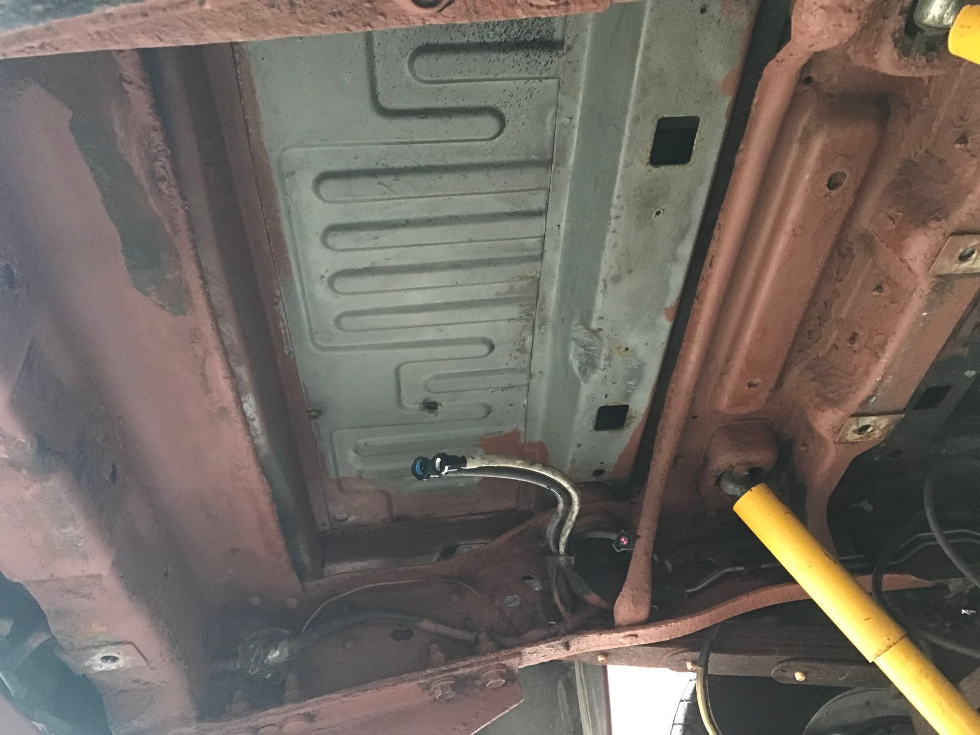Underside wire brushed and primed for paint.