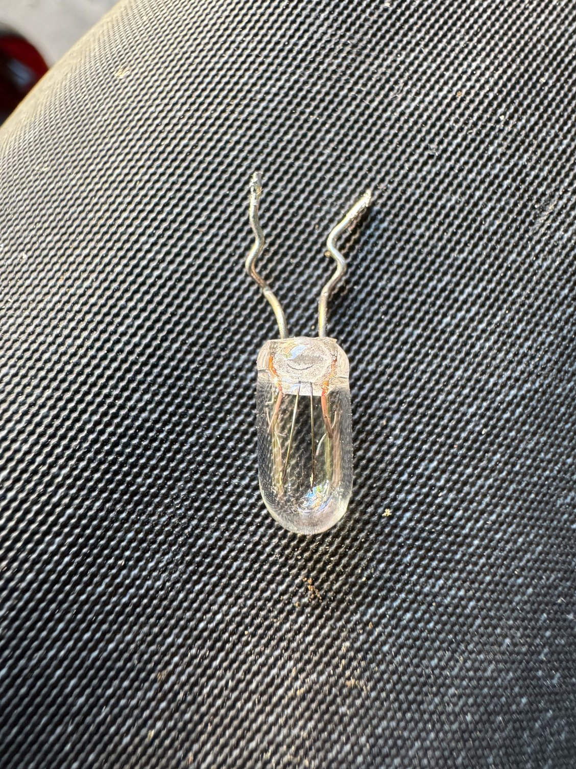 The bulb I sweated off the PCB.  I carefully got the yellow plastic sleeve off of it and put that on the new bulb after soldering was done.