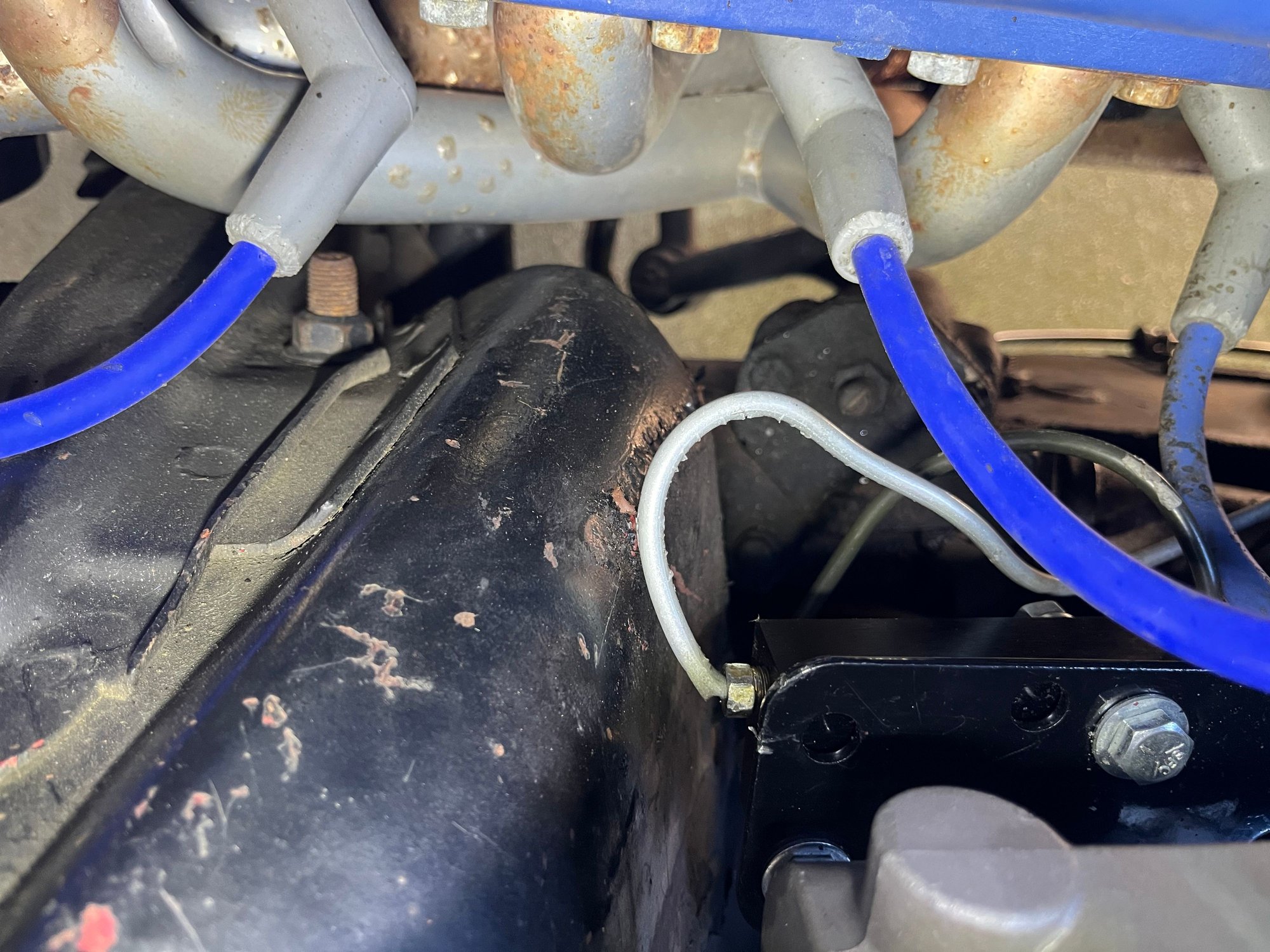 Here is a pic of that rear brake line from a different angle, you can see its definitely not in a comfortable position.